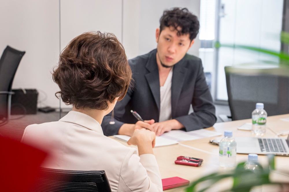 Japanese-woman-interviewed2 computer user in conference room